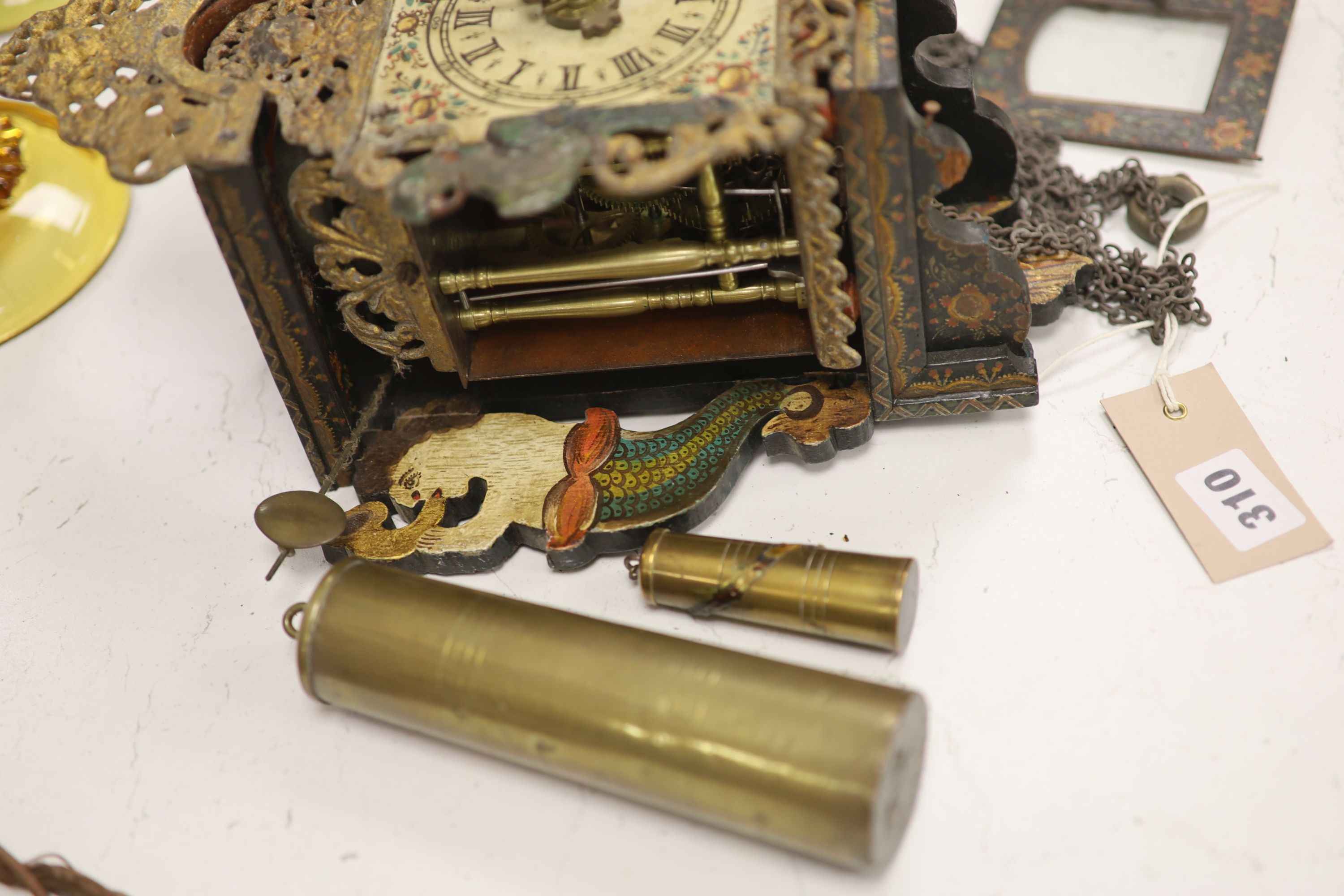 A German painted wood and metal wall clock retailed by Camerer, Cuss & co